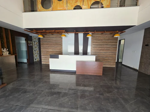 Reception at the Bahadurgarh office, where drawings and layouts are reviewed with buyers.